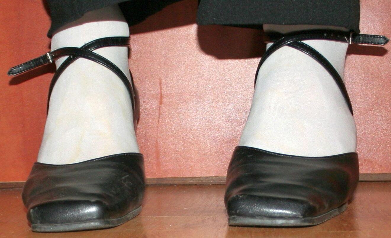 legs in tights with traces of cum in the shoes