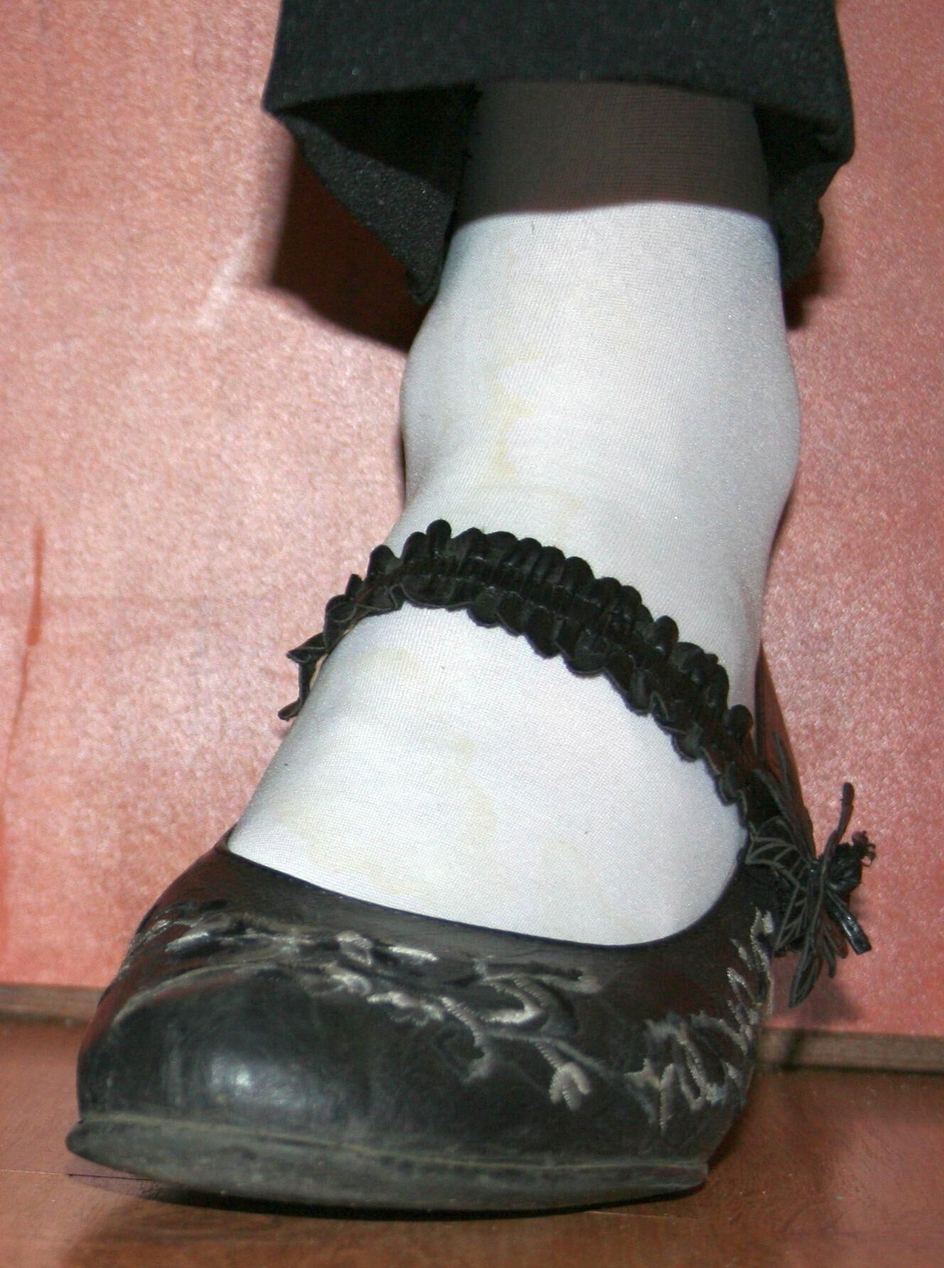 legs in tights with traces of cum in the shoes