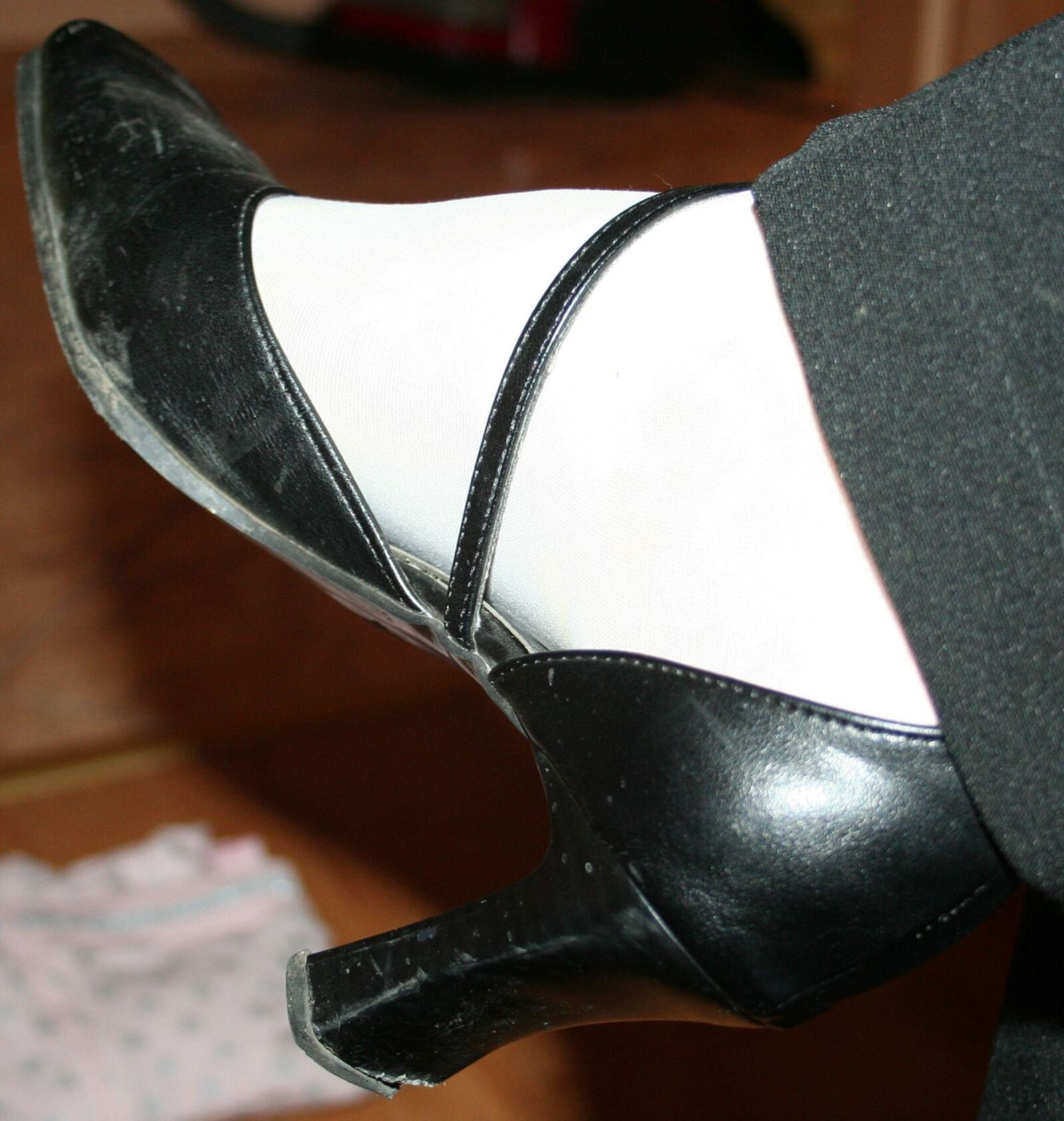 legs in tights with traces of cum in the shoes
