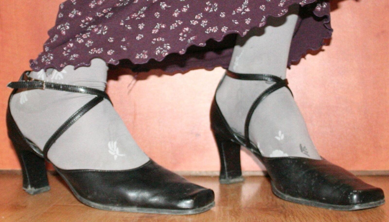 legs in tights with traces of cum in the shoes