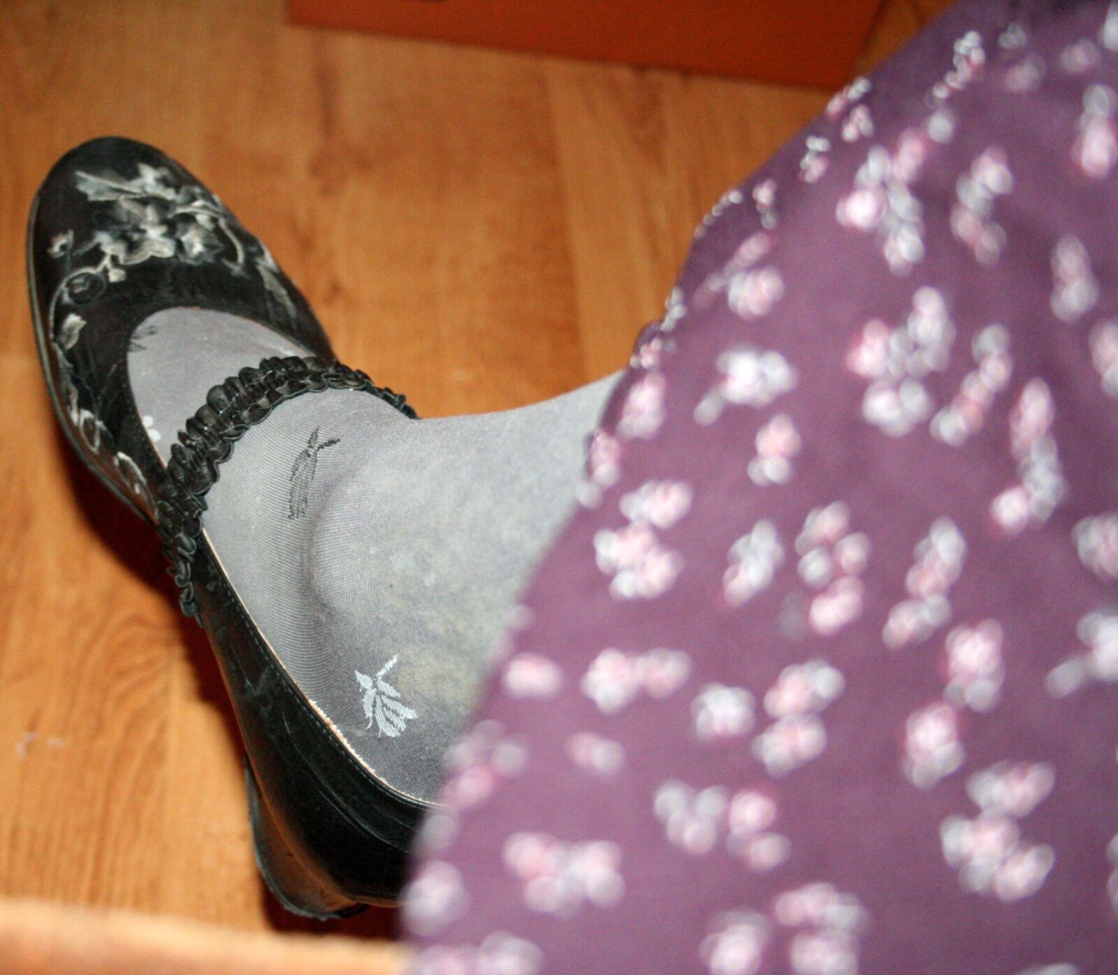 legs in tights with traces of cum in the shoes