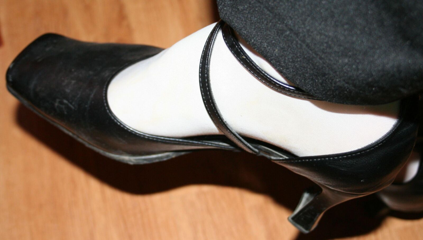 legs in tights with traces of cum in the shoes
