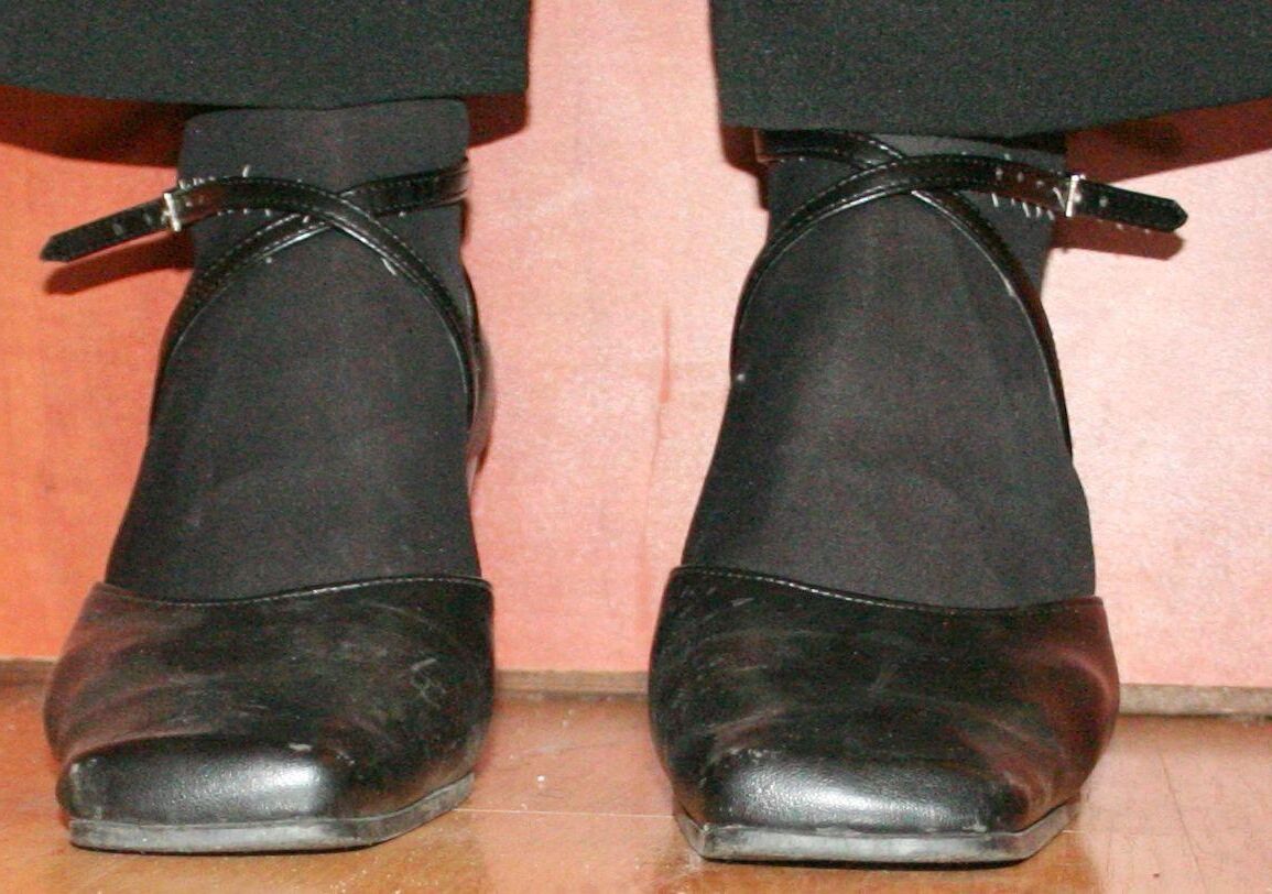 legs in tights with traces of cum in the shoes