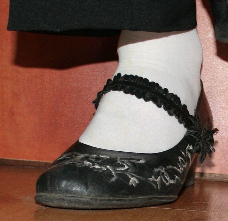 legs in tights with traces of cum in the shoes