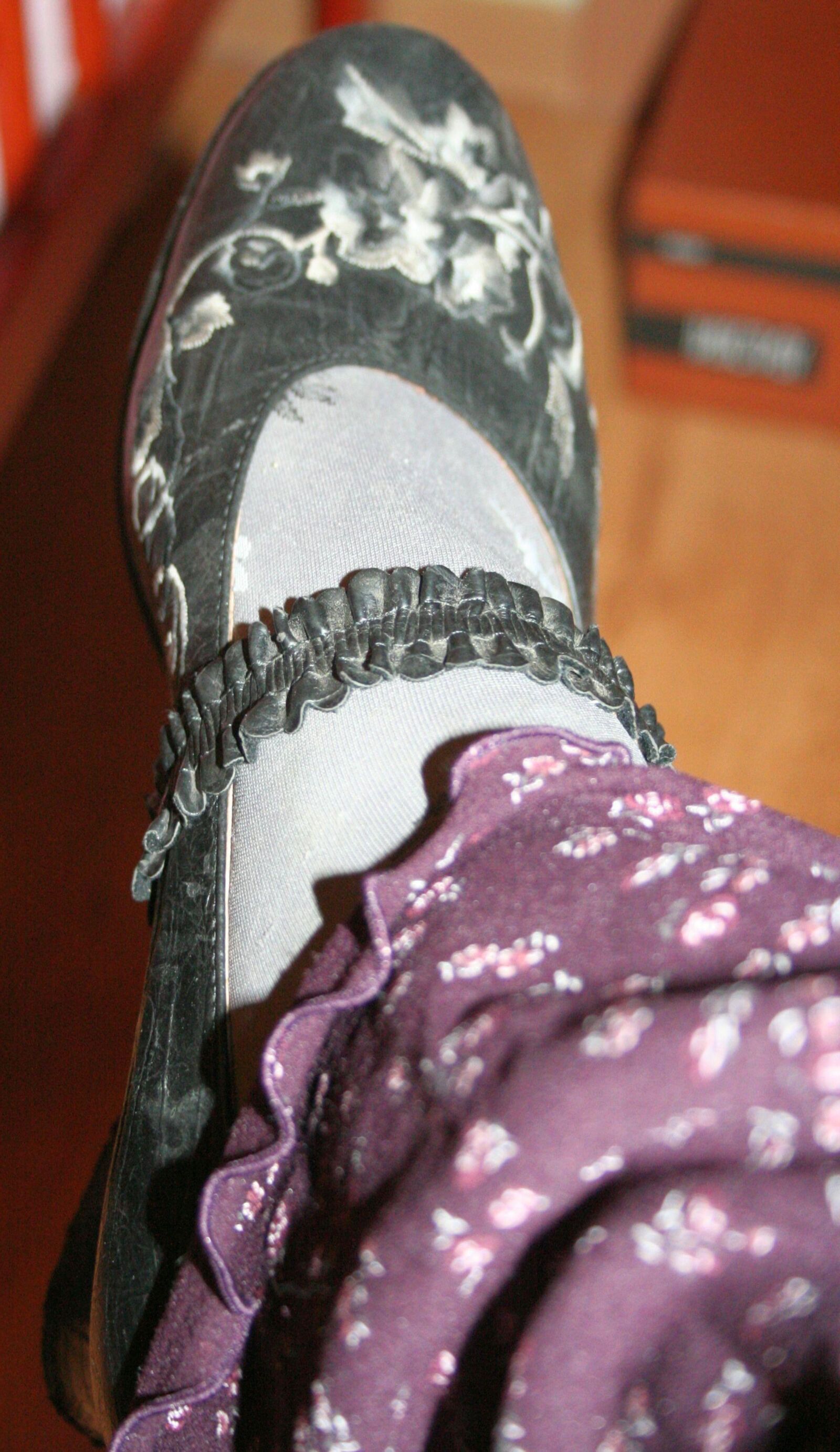 legs in tights with traces of cum in the shoes