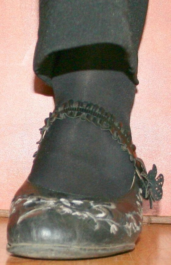 legs in tights with traces of cum in the shoes