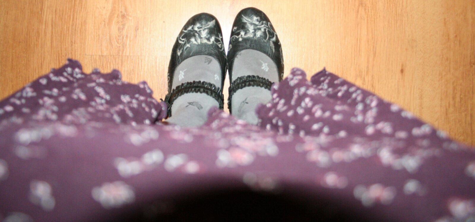 legs in tights with traces of cum in the shoes