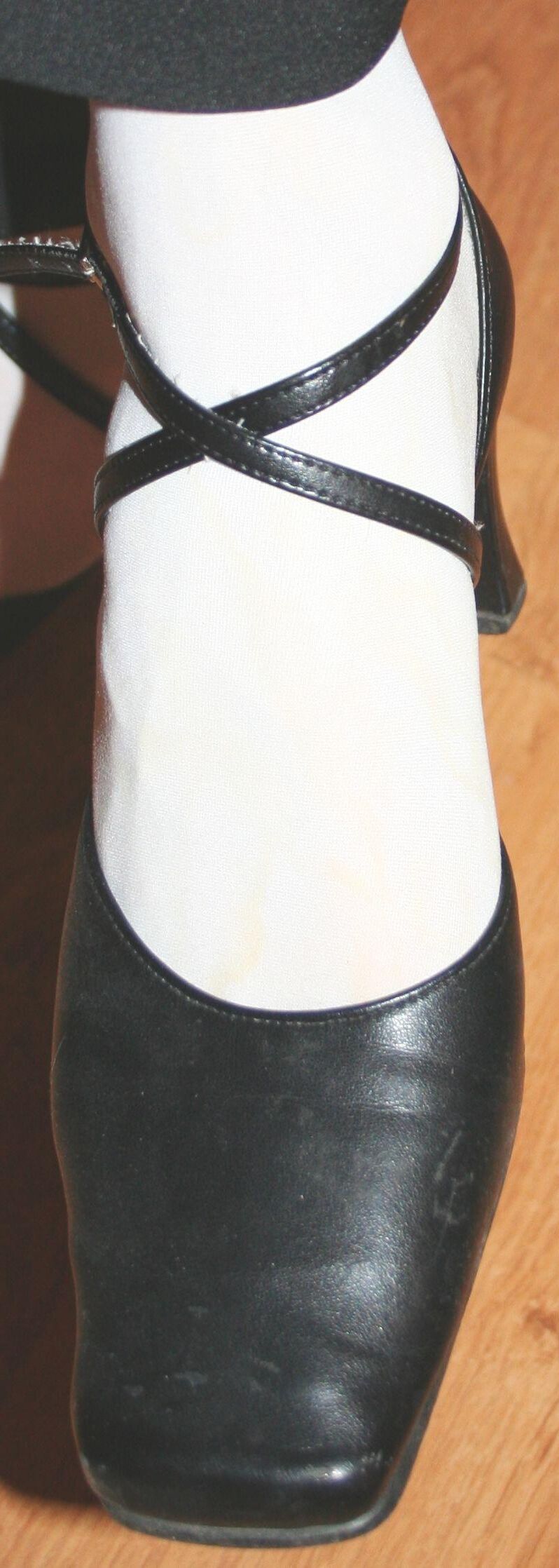 legs in tights with traces of cum in the shoes
