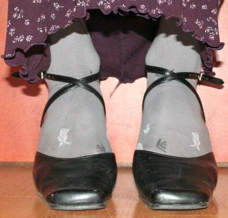 legs in tights with traces of cum in the shoes