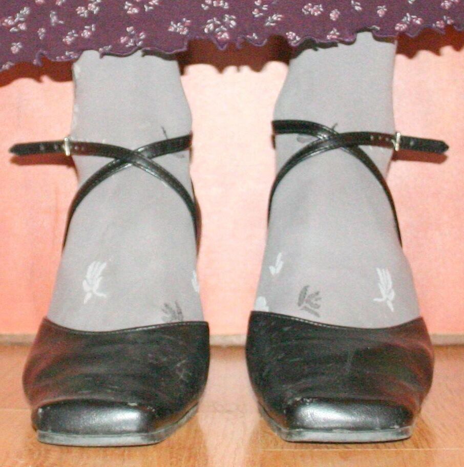 legs in tights with traces of cum in the shoes