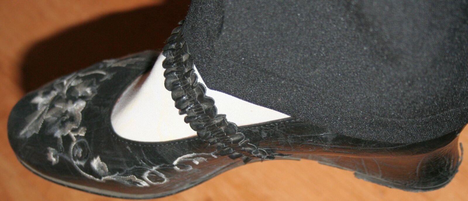 legs in tights with traces of cum in the shoes