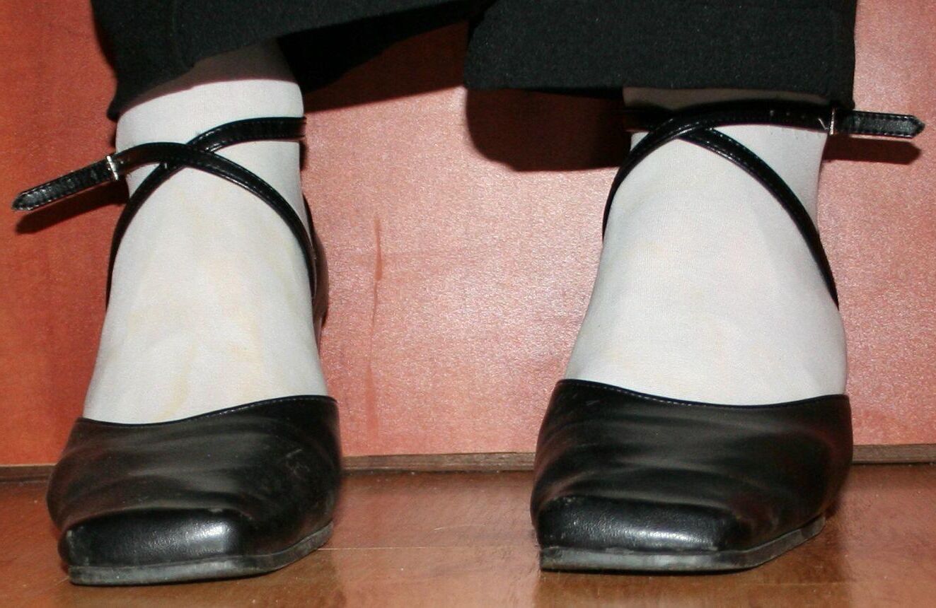 legs in tights with traces of cum in the shoes