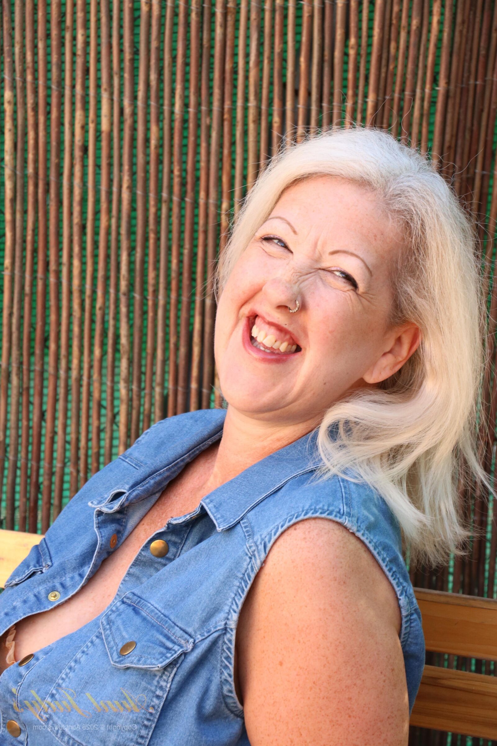 Maggie Moon yo Soaks Up Sun and Plays on an Outdoor Bench