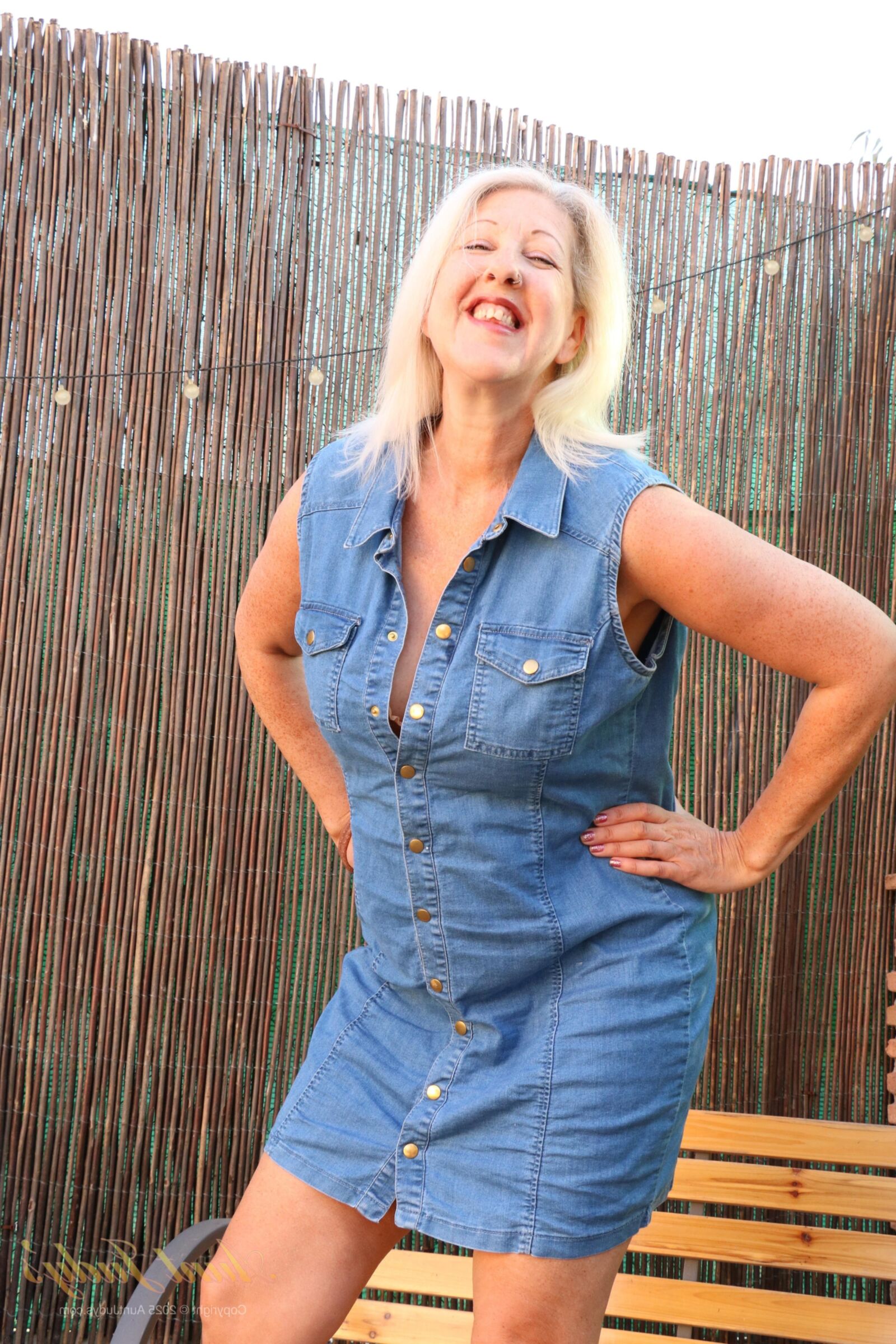 Maggie Moon yo Soaks Up Sun and Plays on an Outdoor Bench